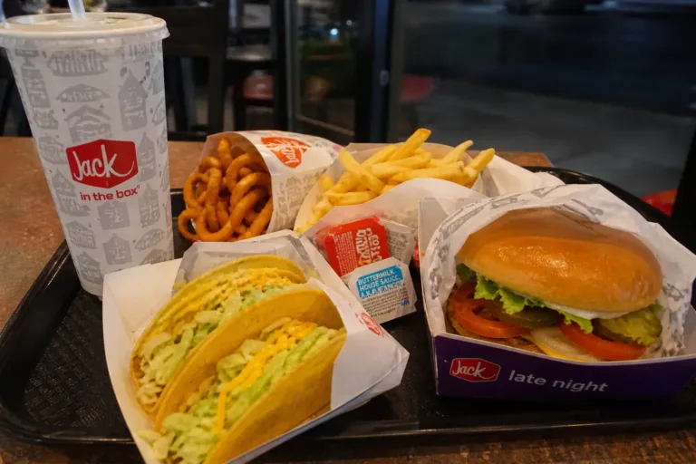 Build Your Own Munchie Meal Jack in the Box combo with burger, fries, tacos, and drink served on a tray