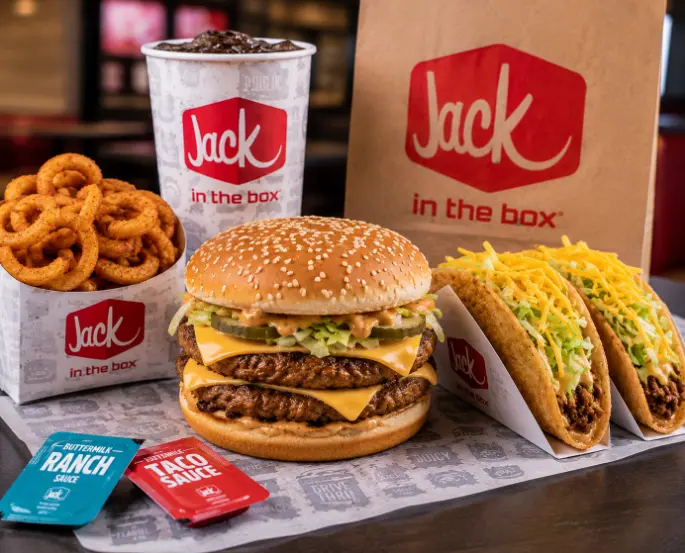 Jack in the Box combo meal with Jumbo Jack, curly fries, tacos, and drink
